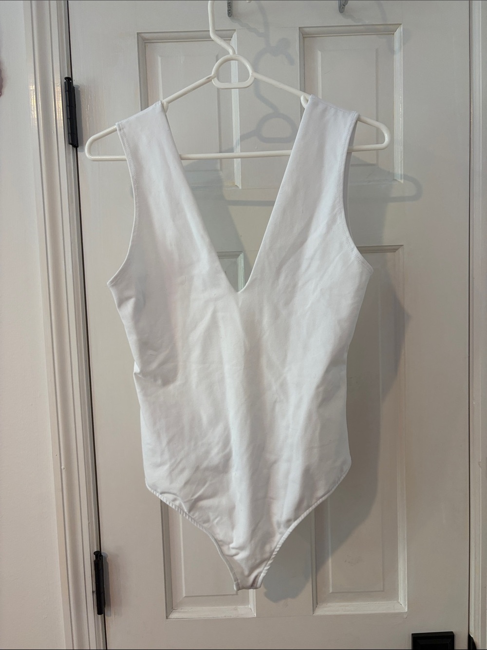 White V-Neck Bodysuit. Free People
